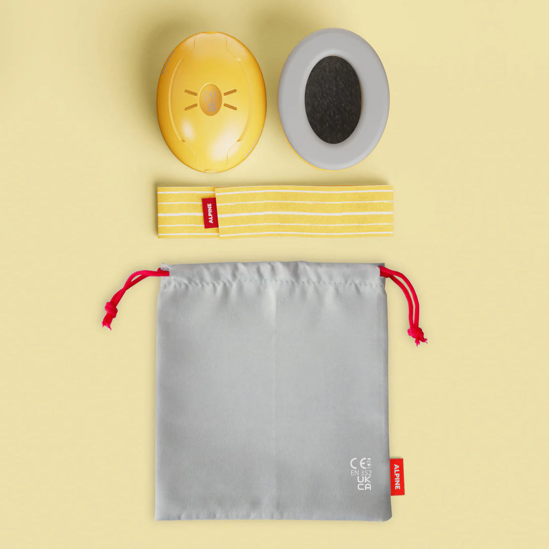 Alpine Muffy Baby Earmuffs in yellow with included accessories: ear cups, adjustable headband, and storage bag for convenient and hygienic storage.