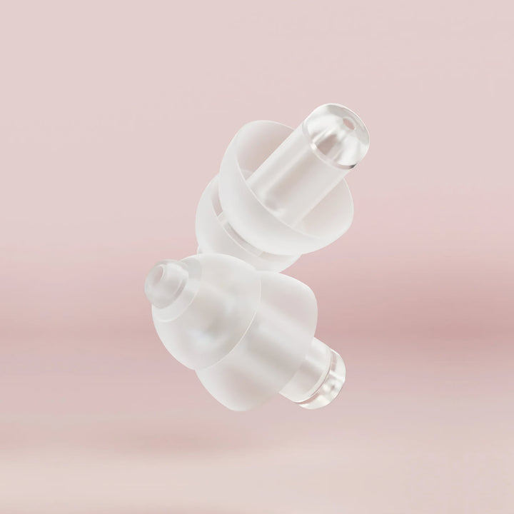 Close-up of Alpine PartyPlug Earplugs featuring transparent acoustic filters for high-fidelity sound reduction and comfortable fit.