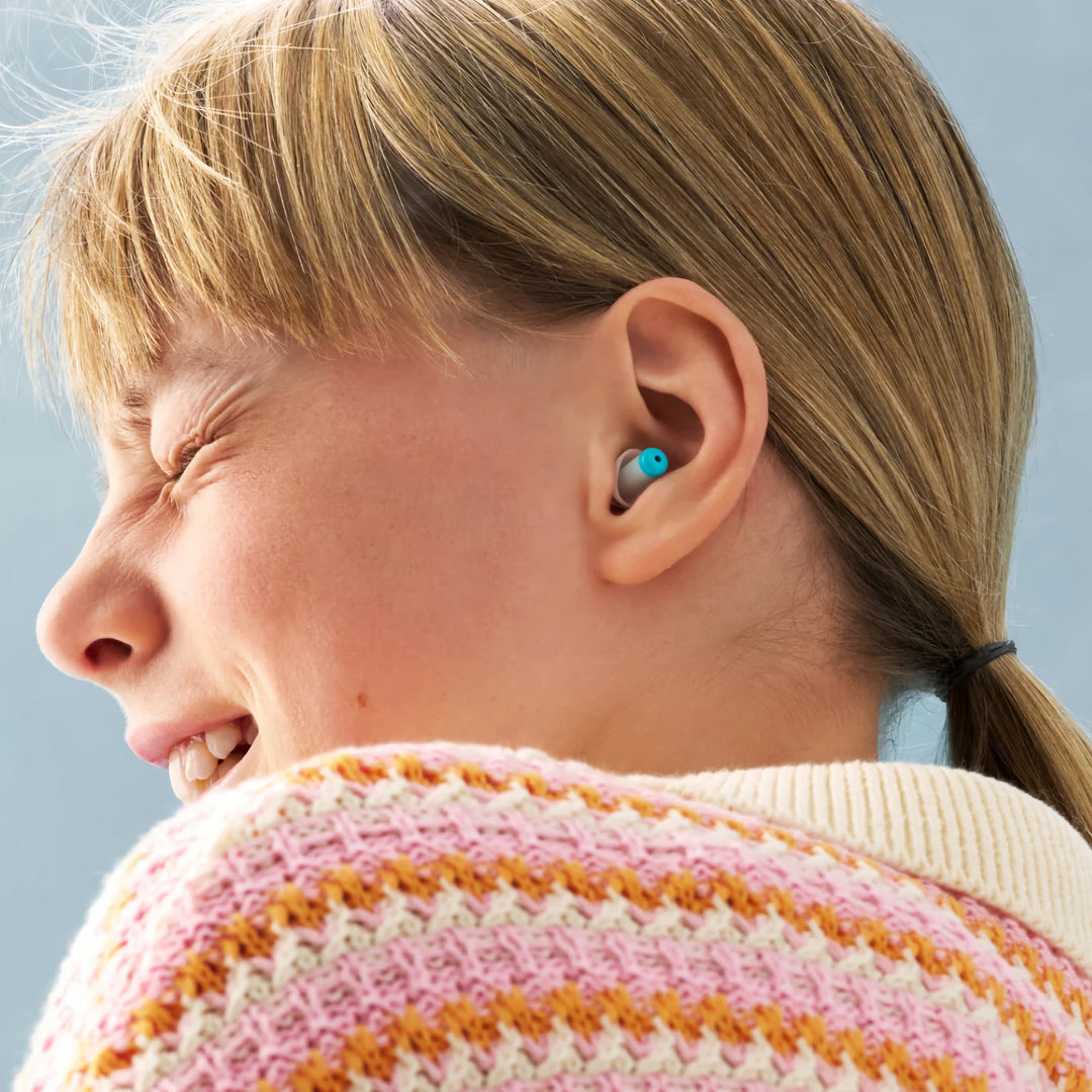 Child wearing Alpine Pluggies Kids Earplugs, designed for noise reduction, hearing protection, and a comfortable fit for children.