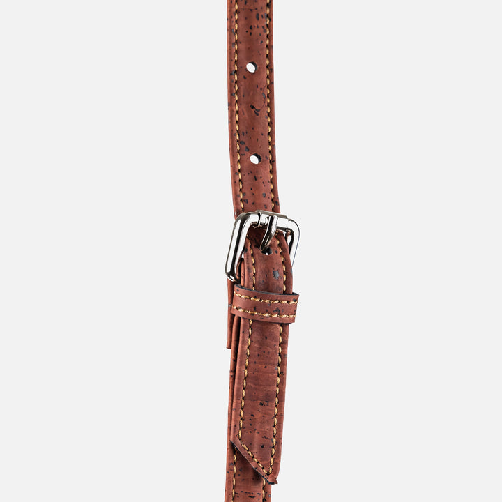Close-up of adjustable strap and buckle on Corkor Vegan Cork Crossbody Bag in light brown and red