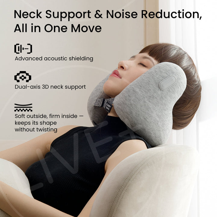 Woman wearing EVERYTHINK E2 travel neck pillow in light gray, relaxing in a chair for neck support and noise reduction