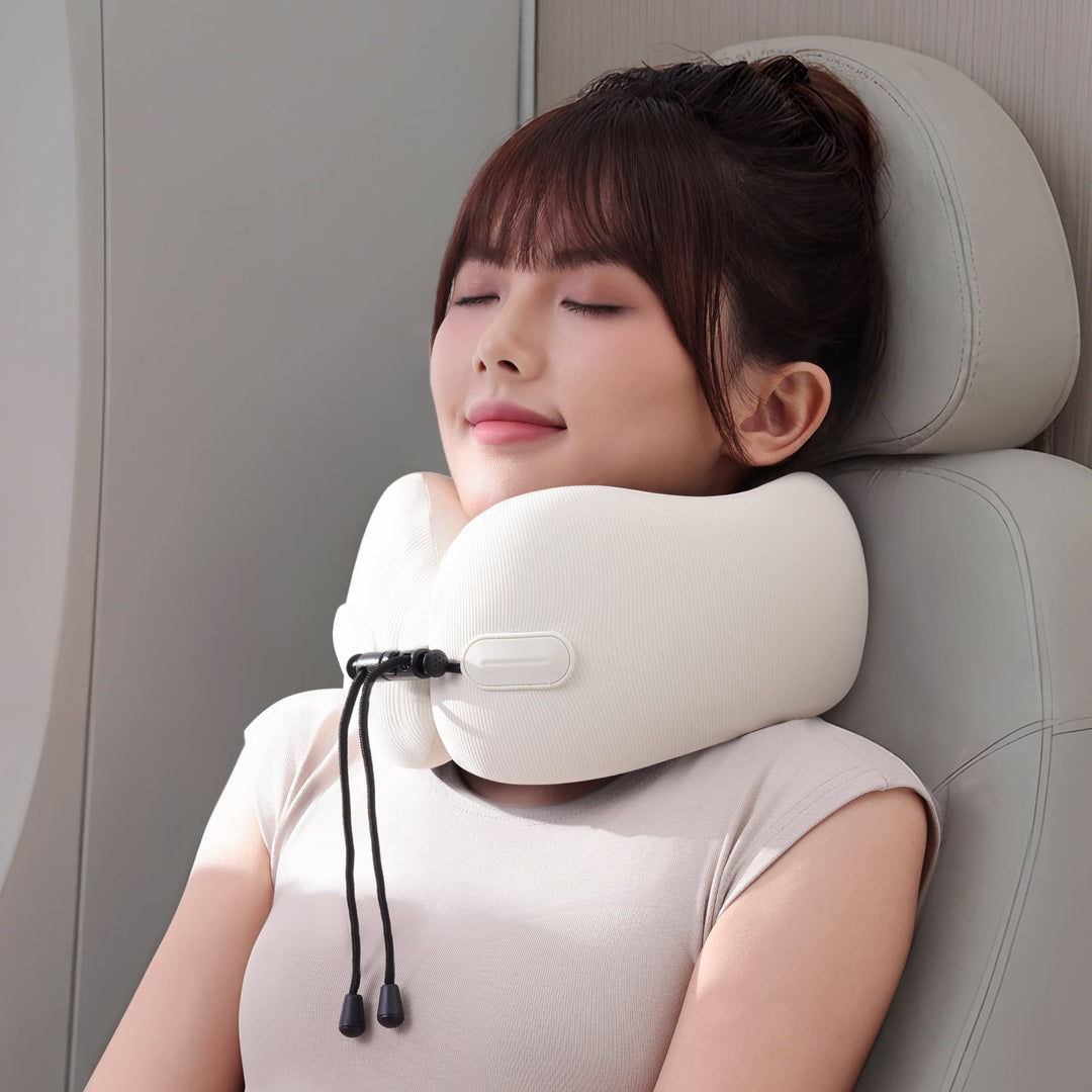 Model using EVERYTHINK EC3 foldable travel neck pillow in Ivory White on an airplane seat