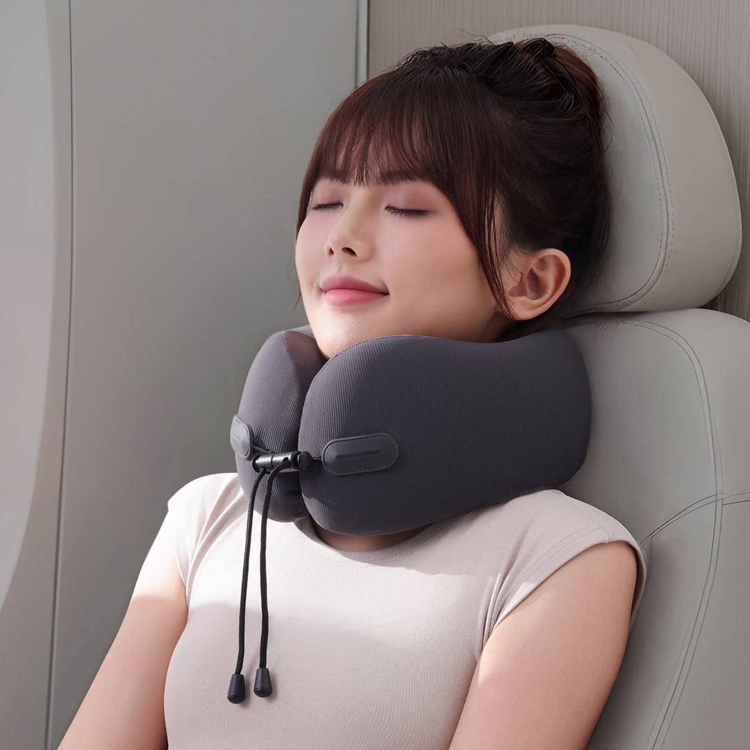 Model using EVERYTHINK EC3 Obsidian Black travel neck pillow during flight for ergonomic support