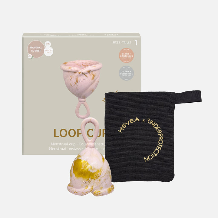 Hevea Loop Menstrual Cup Size 1 in Golden Blush with box and black storage pouch, made from natural rubber