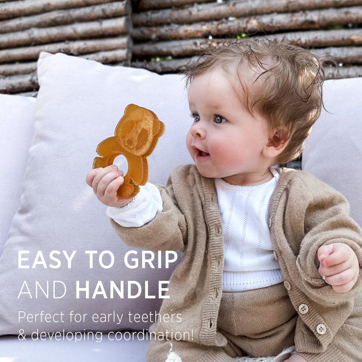 Baby holding HEVEA Panda Teether, easy to grip and ideal for developing hand coordination during early teething