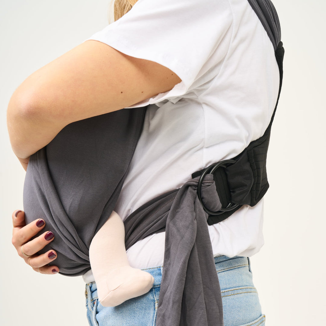 Close-up of side view showing adjustable ring on Koala Babycare Cuddle Band 2 in dark gray