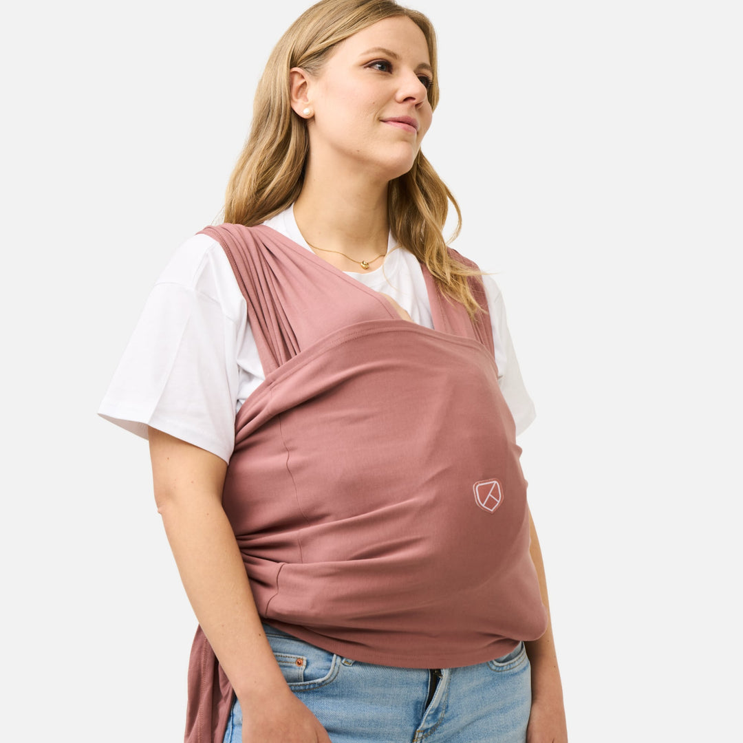 Soft and breathable Koala Babycare Koala Cuddle Band 2 baby wrap in earth red, perfect for hands-free babywearing.