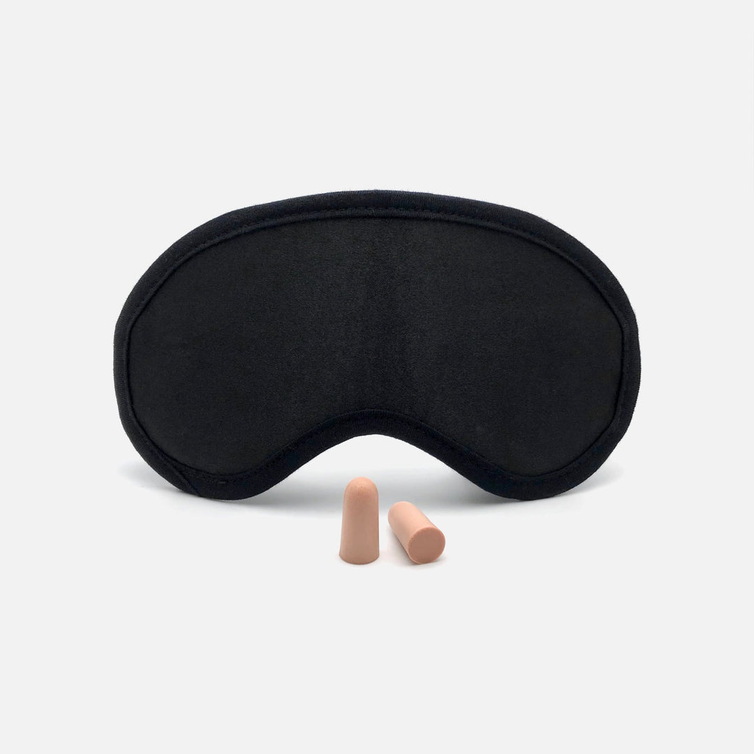 Front view of Mack's Shut-Eye Shade Sleep Mask with a pair of soft foam earplugs.