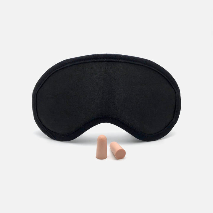 Front view of Mack's Shut-Eye Shade Sleep Mask with a pair of soft foam earplugs.