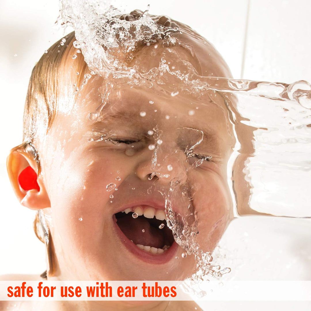Child splashing water while wearing Mack's earplugs, safe for use with ear tubes and provides waterproof ear protection