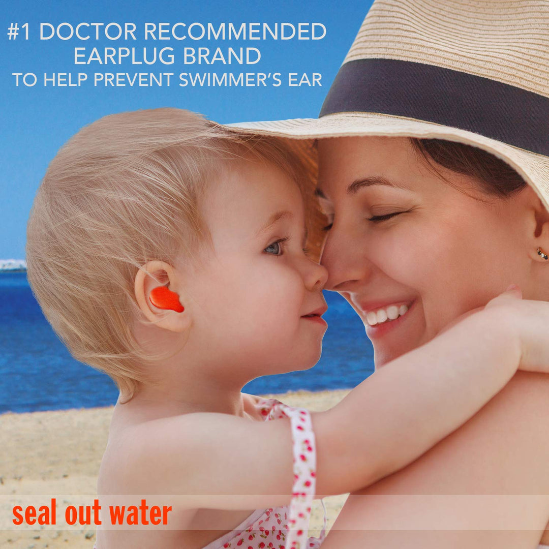Child on the beach wearing Mack's earplugs with mother, helps prevent swimmer's ear by sealing out water