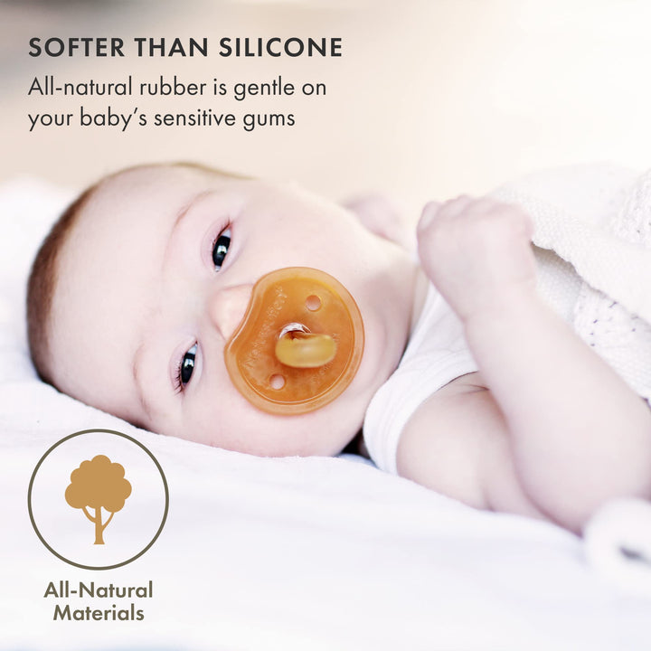 Baby using Natursutten Natural Rubber Butterfly Pacifier, softer than silicone, made from all-natural rubber for gentle gum support.