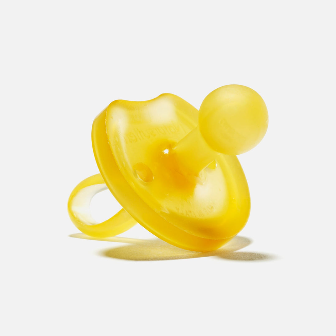 Large yellow Natursutten butterfly-shaped natural rubber pacifier with rounded nipple for toddlers 12 months and up