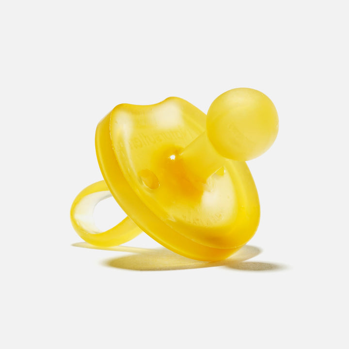 Large yellow Natursutten butterfly-shaped natural rubber pacifier with rounded nipple for toddlers 12 months and up
