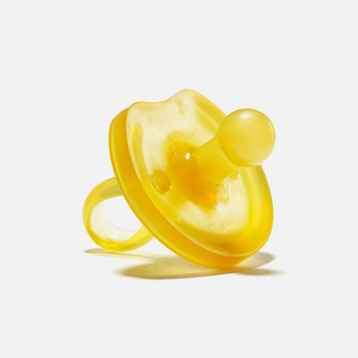 Small yellow Natursutten butterfly-shaped natural rubber pacifier with rounded nipple for newborns 0–6 months