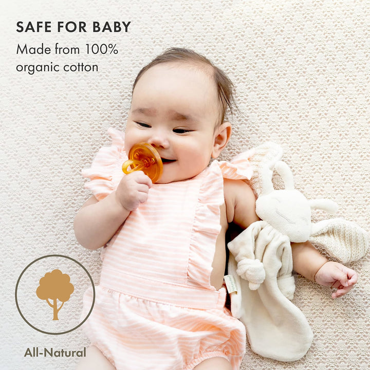 Baby using Natursutten PaciPixy comforter and pacifier, made from 100% organic cotton, safe and natural for newborns.