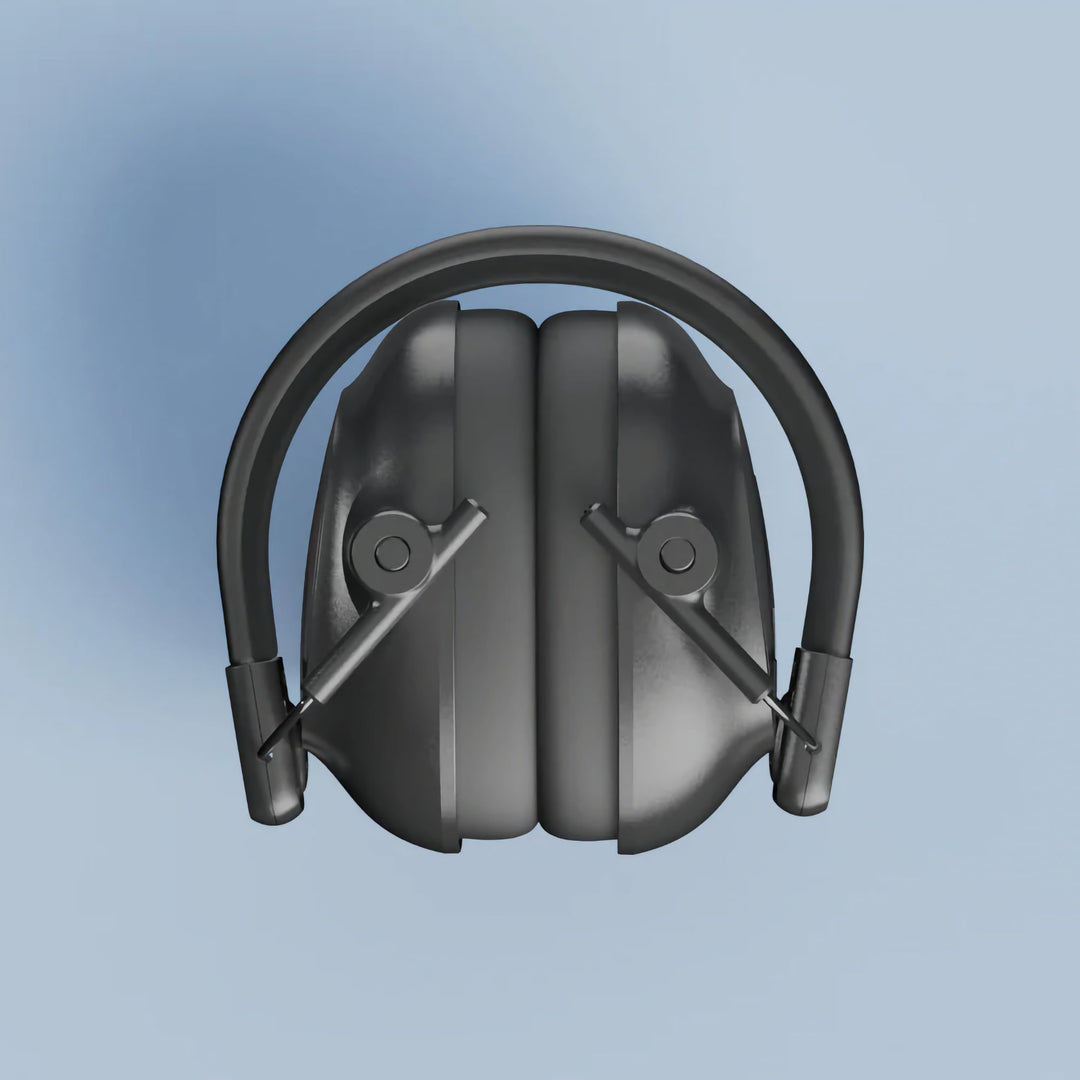 Top view of folded Alpine Defender Earmuffs in compact travel size on a light blue background