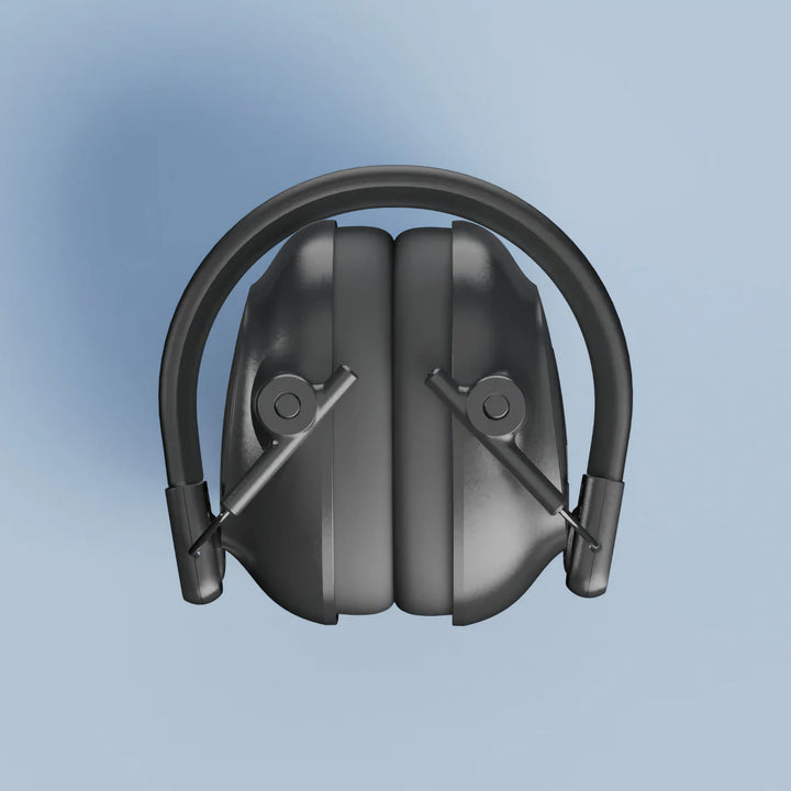 Top view of folded Alpine Defender Earmuffs in compact travel size on a light blue background