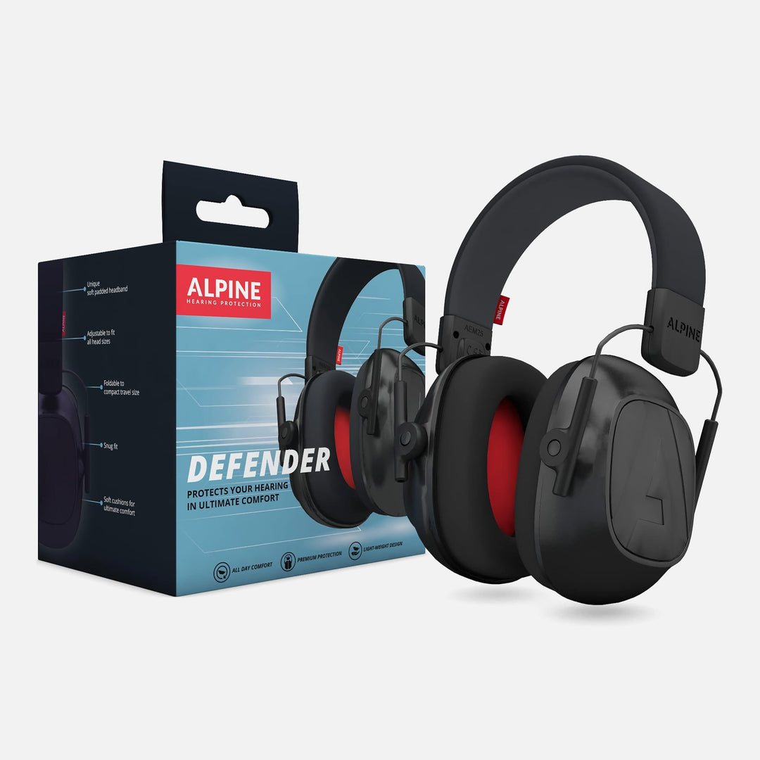 Alpine Defender Earmuffs shown with product packaging, featuring black design with red interior cushions