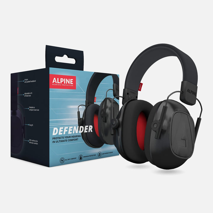 Alpine Defender Earmuffs shown with product packaging, featuring black design with red interior cushions