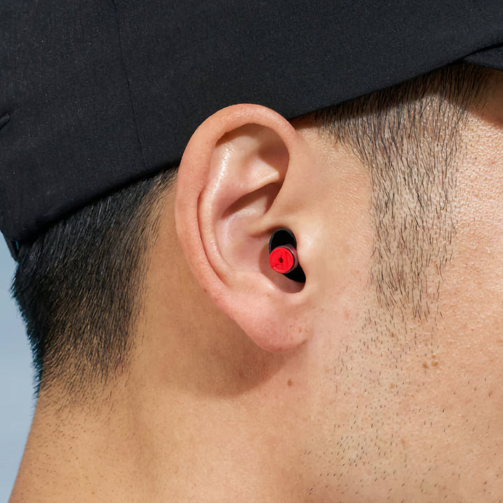 Close-up of Alpine Formula 1® Racing Pro Earplug fitted in ear.