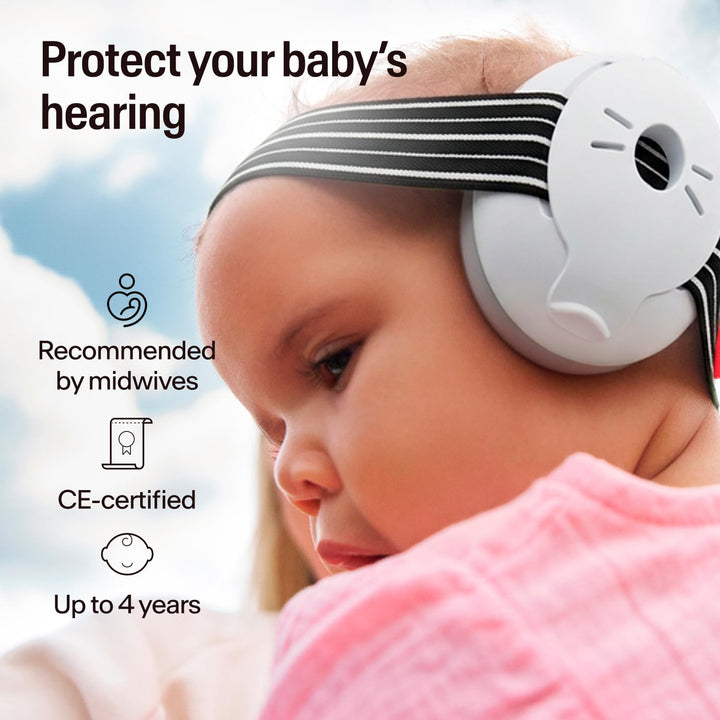 Baby wearing Alpine Muffy Baby Classic black earmuffs with striped headband, suitable up to 4 years
