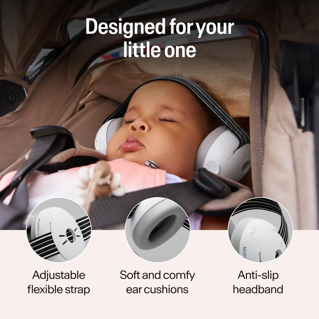 Baby sleeping in stroller wearing Alpine Muffy Baby Classic black earmuffs with adjustable headband