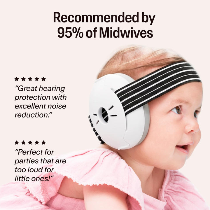Baby wearing Alpine Muffy Baby Classic black earmuffs with striped headband in lifestyle scene
