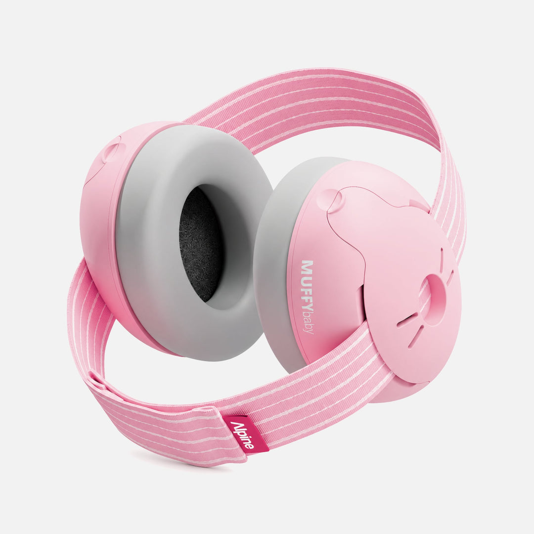 Blush Alpine Muffy Baby earmuffs with a striped headband and gray padded ear cups on a white background
