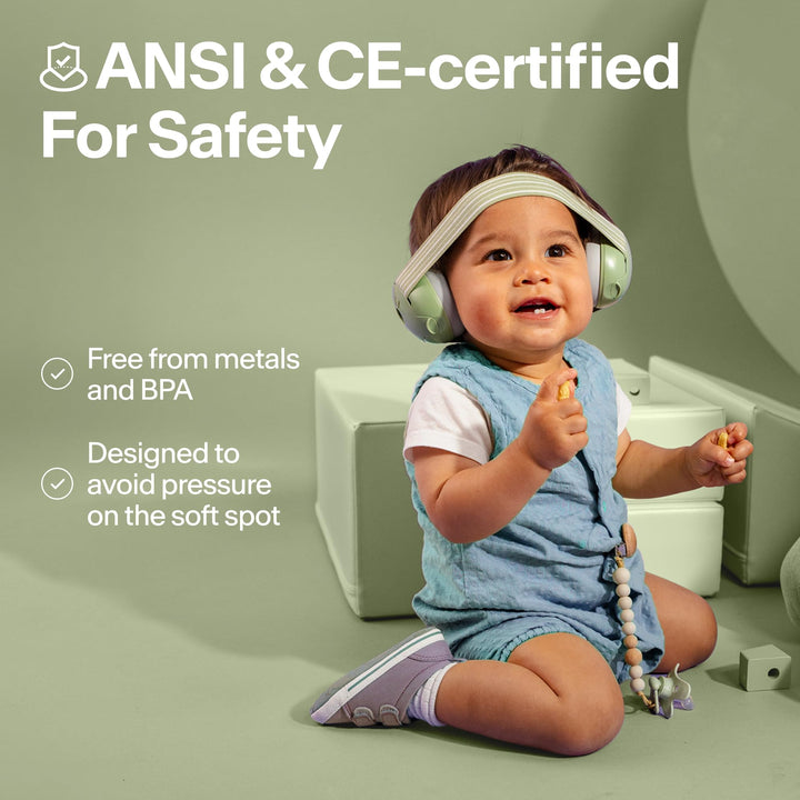 Toddler wearing Alpine Muffy Baby Classic earmuffs with ANSI and CE safety certification information