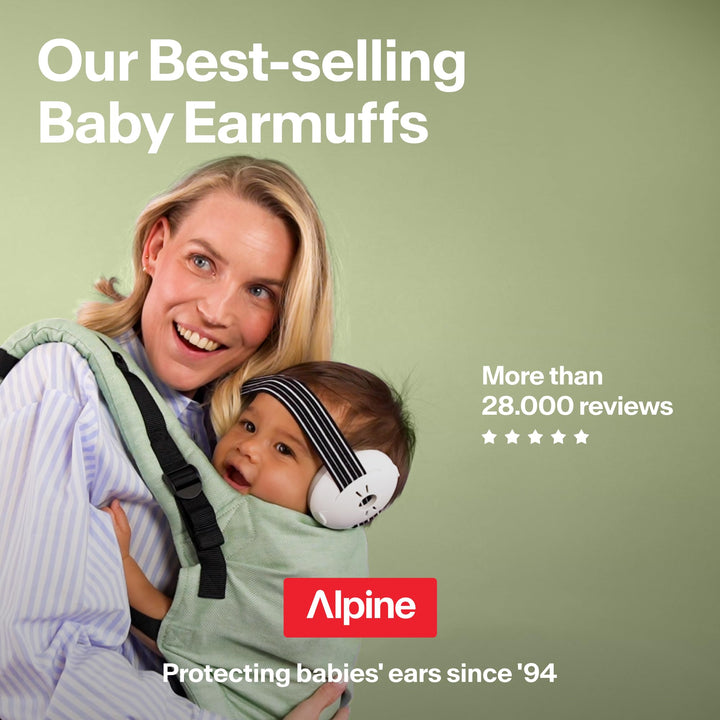 Parent carrying baby wearing white Alpine Muffy Baby Classic earmuffs with black striped headband
