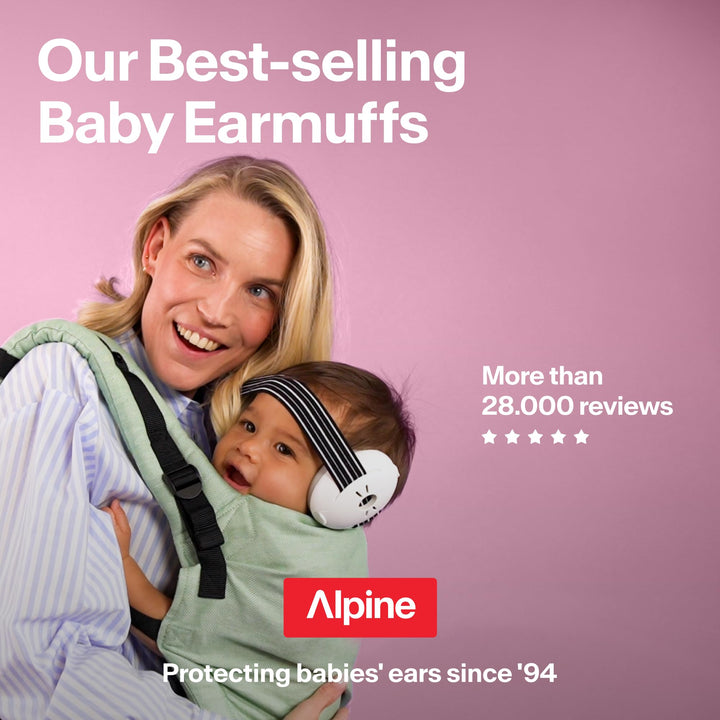 Parent carrying baby wearing white Alpine Muffy Baby Classic earmuffs with black striped headband