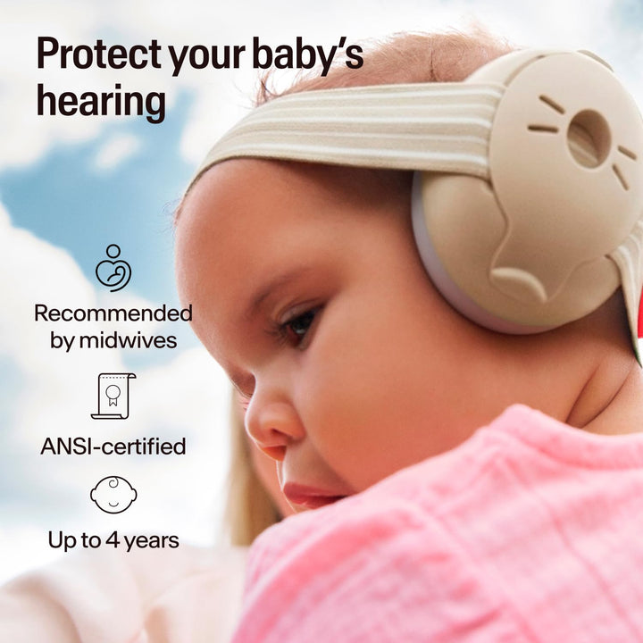 Baby wearing Alpine Muffy Baby Classic Sand earmuffs with striped headband, suitable up to 4 years