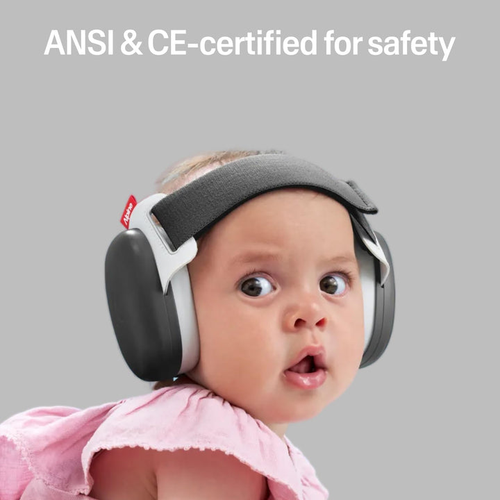 Baby wearing Alpine Muffy Baby Comfort Dusk Black earmuffs with ANSI and CE safety certification highlighted
