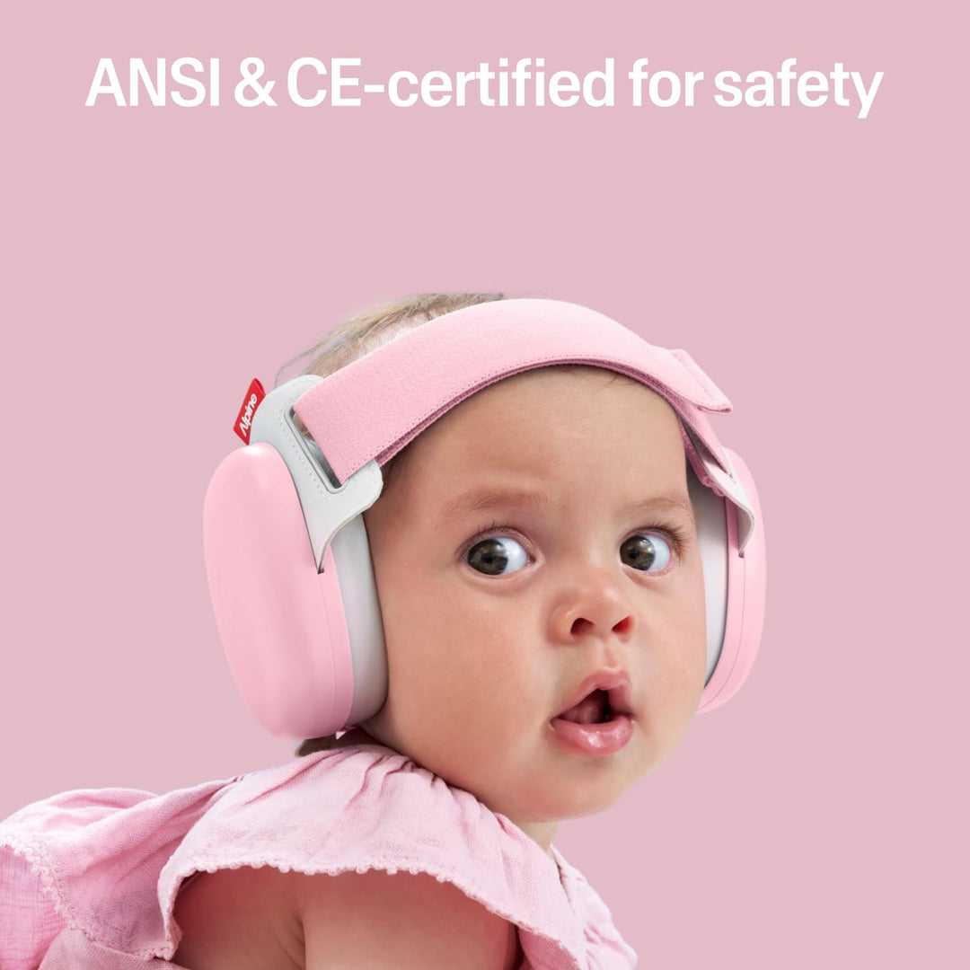 Baby wearing Alpine Muffy Baby Comfort earmuffs Rose Pink showing CE and ANSI certified infant hearing protection