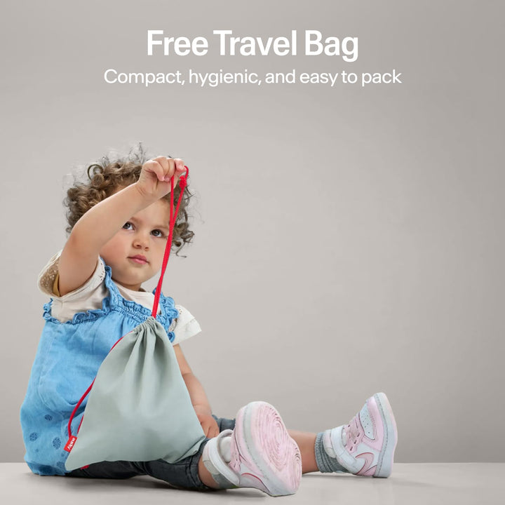 Child holding Alpine Muffy Baby Comfort earmuffs travel bag showing compact hygienic storage pouch for baby earmuffs