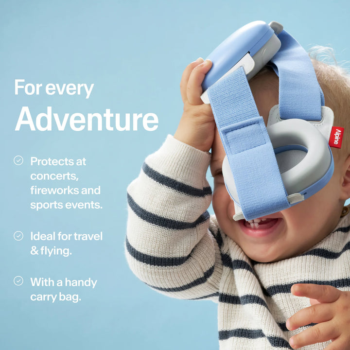 Baby playing with Alpine Muffy Baby Sky Blue earmuffs, ideal for concerts, fireworks, sports, travel, and safe adventures