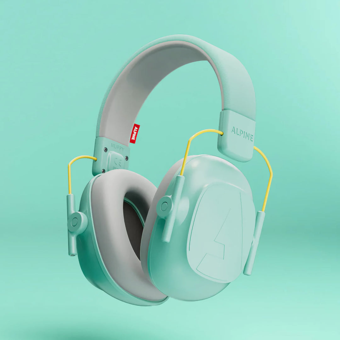 Close-up of Alpine Muffy Kids Earmuffs in mint color, featuring an adjustable headband and soft ear cushions for comfortable noise protection for children aged 5–16.