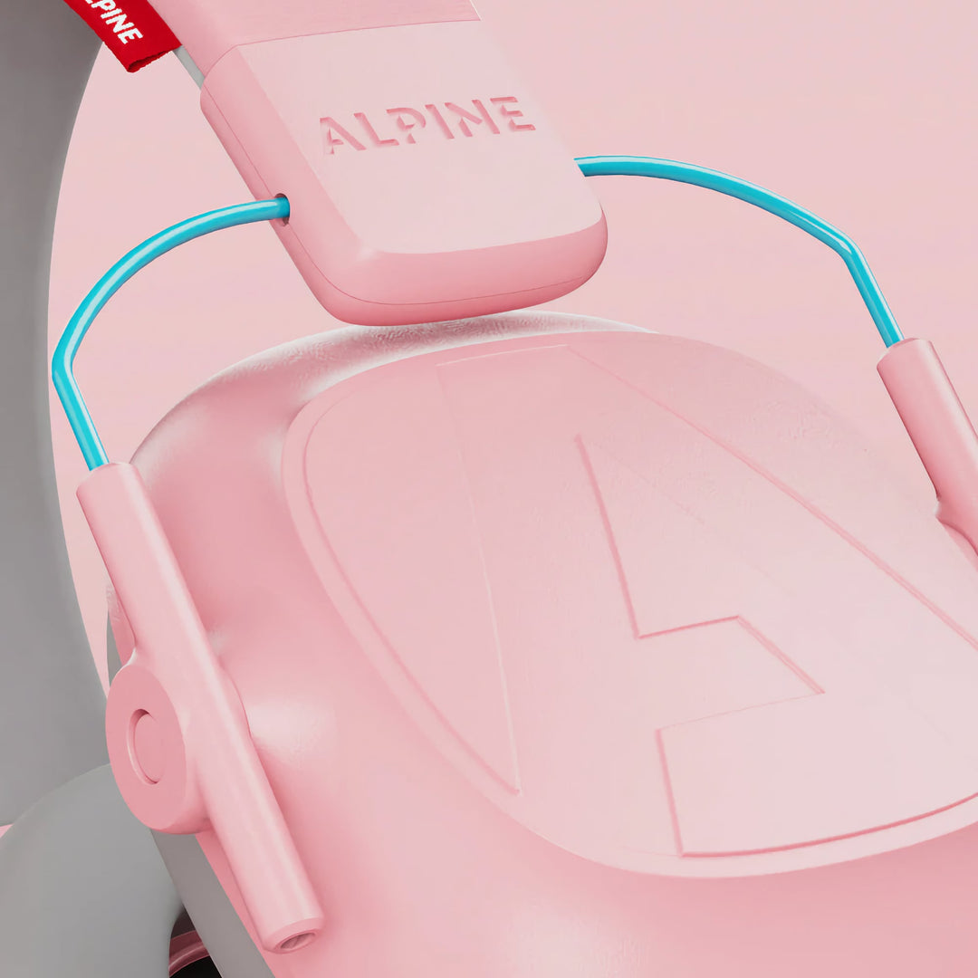 Close-up detail of Alpine Muffy Kids Earmuffs in pink, highlighting the durable materials, soft headband, and noise-reducing ear cups for children aged 5–16.