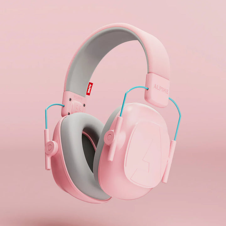 Close-up of Alpine Muffy Kids Earmuffs in pink, designed with an adjustable headband and cushioned ear pads for comfortable noise protection for children aged 5–16.