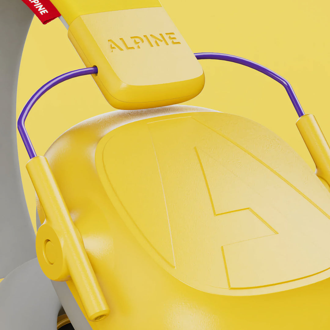 Close-up detail of Alpine Muffy Kids Earmuffs in yellow, highlighting the durable construction, soft headband, and noise-canceling ear cups for children aged 5–16.