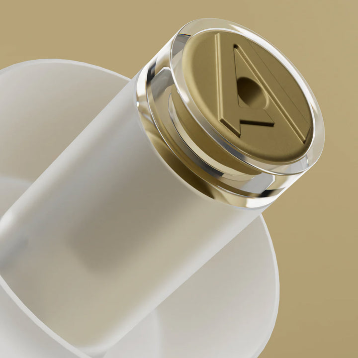 Extreme close-up of Alpine MusicSafe Pro earplug gold filter, designed for safe music listening with clear sound protection