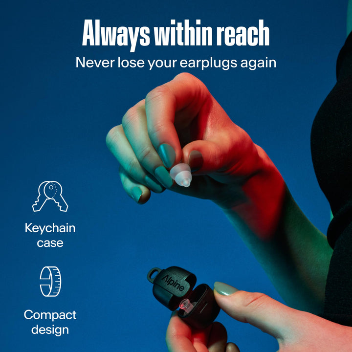 Hands holding an Alpine PartyPlug earplug and open compact carry case with a keychain loop