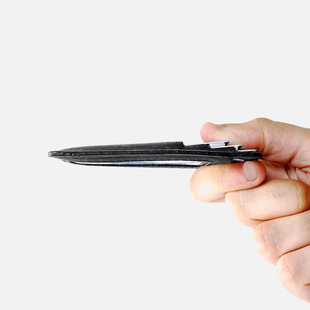 Side view of the Corkor vegan cork RFID card wallet held in hand, showcasing its ultra-slim profile and minimalist design.