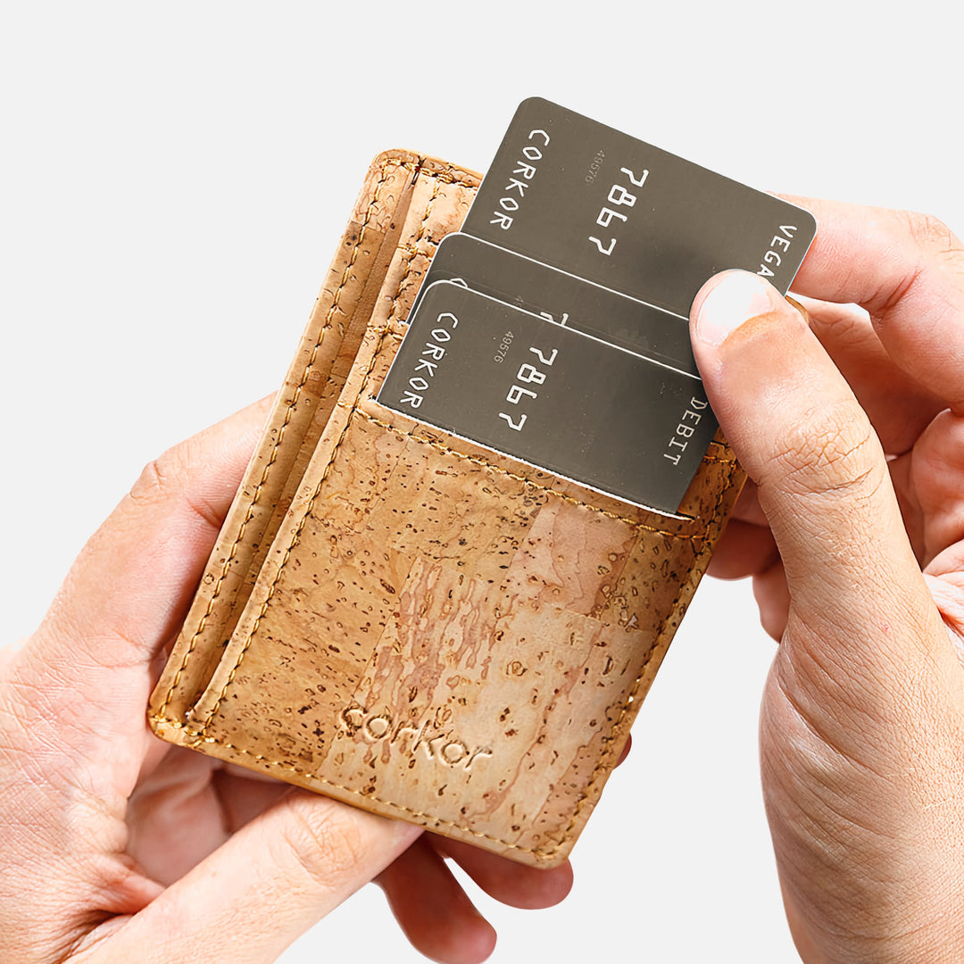 Corkor vegan cork RFID card wallet held in hand, showing card slots filled with cards and the slim, minimalist design.