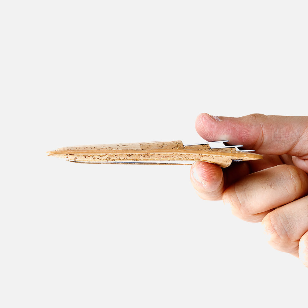 Side view of the Corkor vegan cork RFID card wallet held in hand, showcasing its ultra-slim profile and minimalist design.