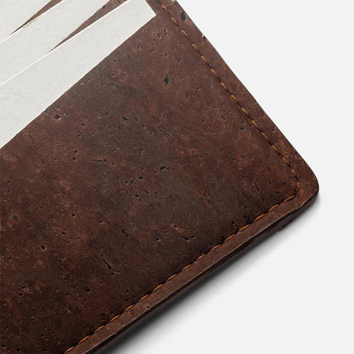 Close-up of dark brown Corkor Vegan Cork Slim Bifold Wallet, showcasing premium cork texture and fine stitching.