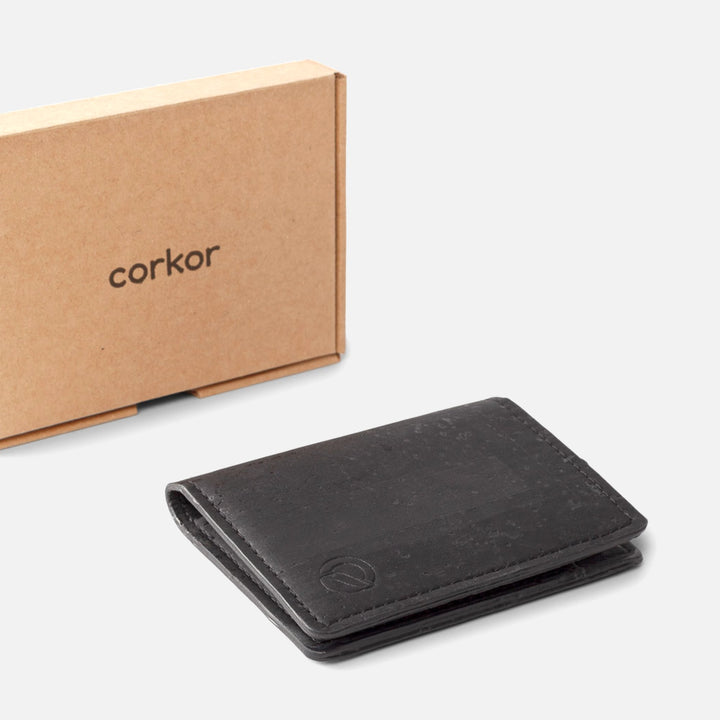 Black Corkor Vegan Cork Wallet with eco-friendly packaging, emphasizing sustainability and minimalist design.