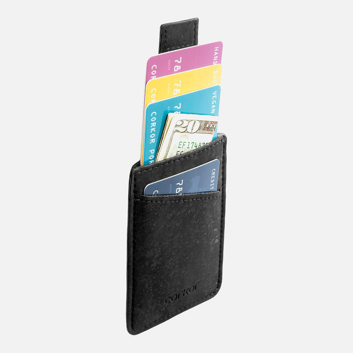 Side view of Corkor CK241 black vegan cork card sleeve wallet, showcasing multiple cards and cash in a compact, eco-friendly design with a convenient pull-tab for easy access.