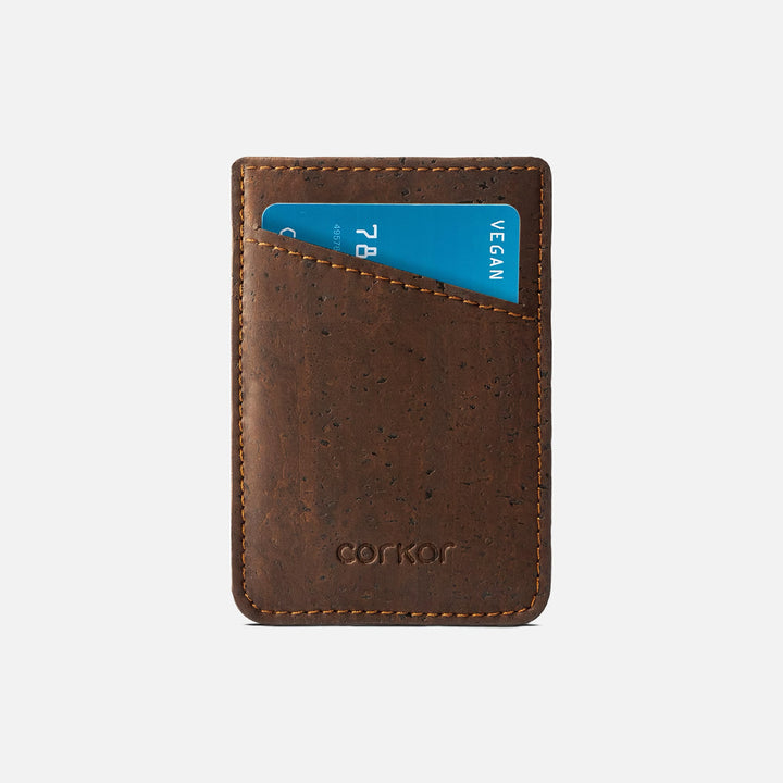 Front view of Corkor CK241 dark brown vegan cork card sleeve wallet, featuring a minimalist design with a debossed logo and eco-friendly cork material, perfect for sustainable card storage.